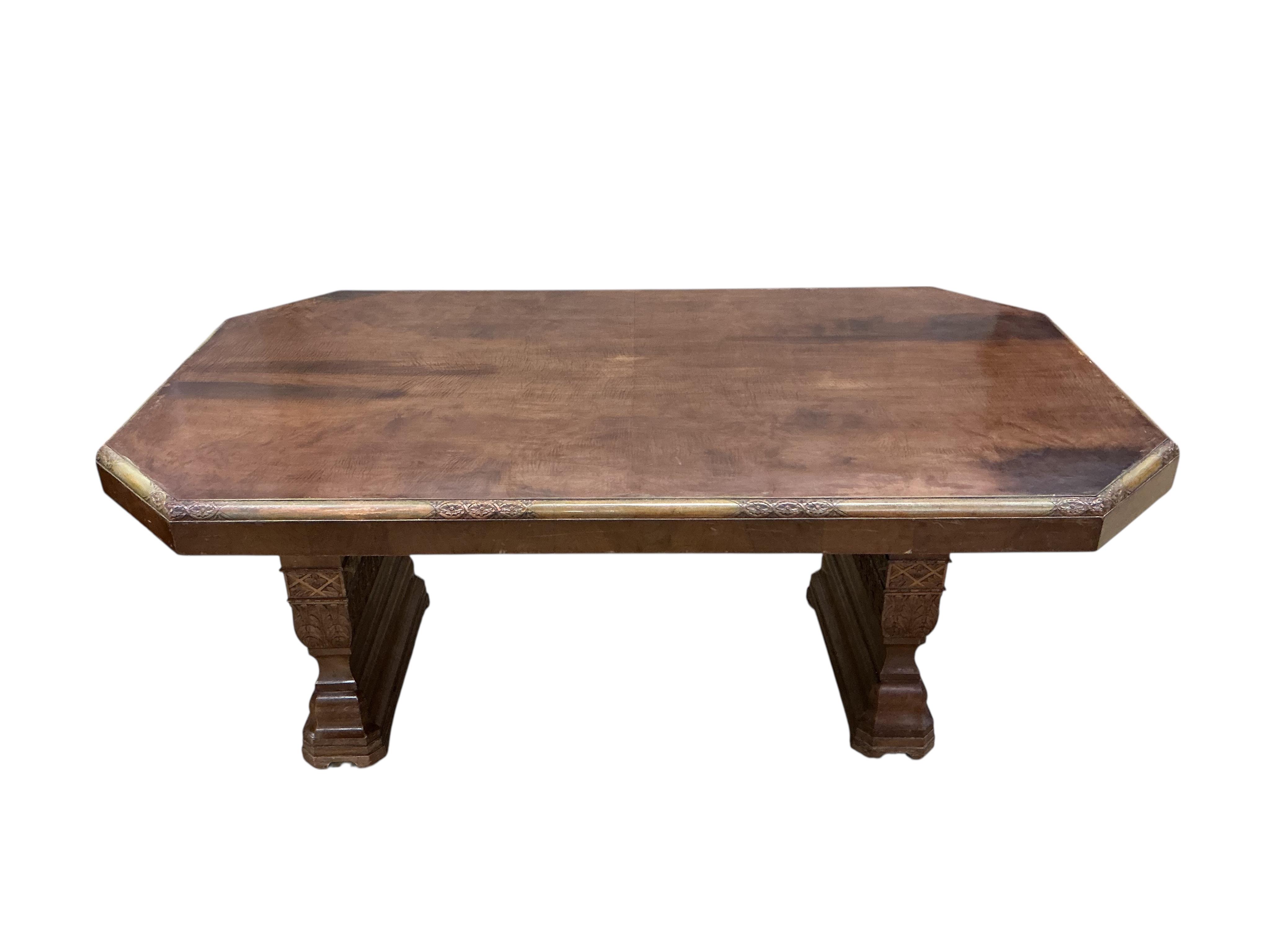An Art deco walnut dining suite, comprising: dining table, width 190cm, depth 110cm, height 80cm together with eight chairs (two being carvers) and a bow front sideboard